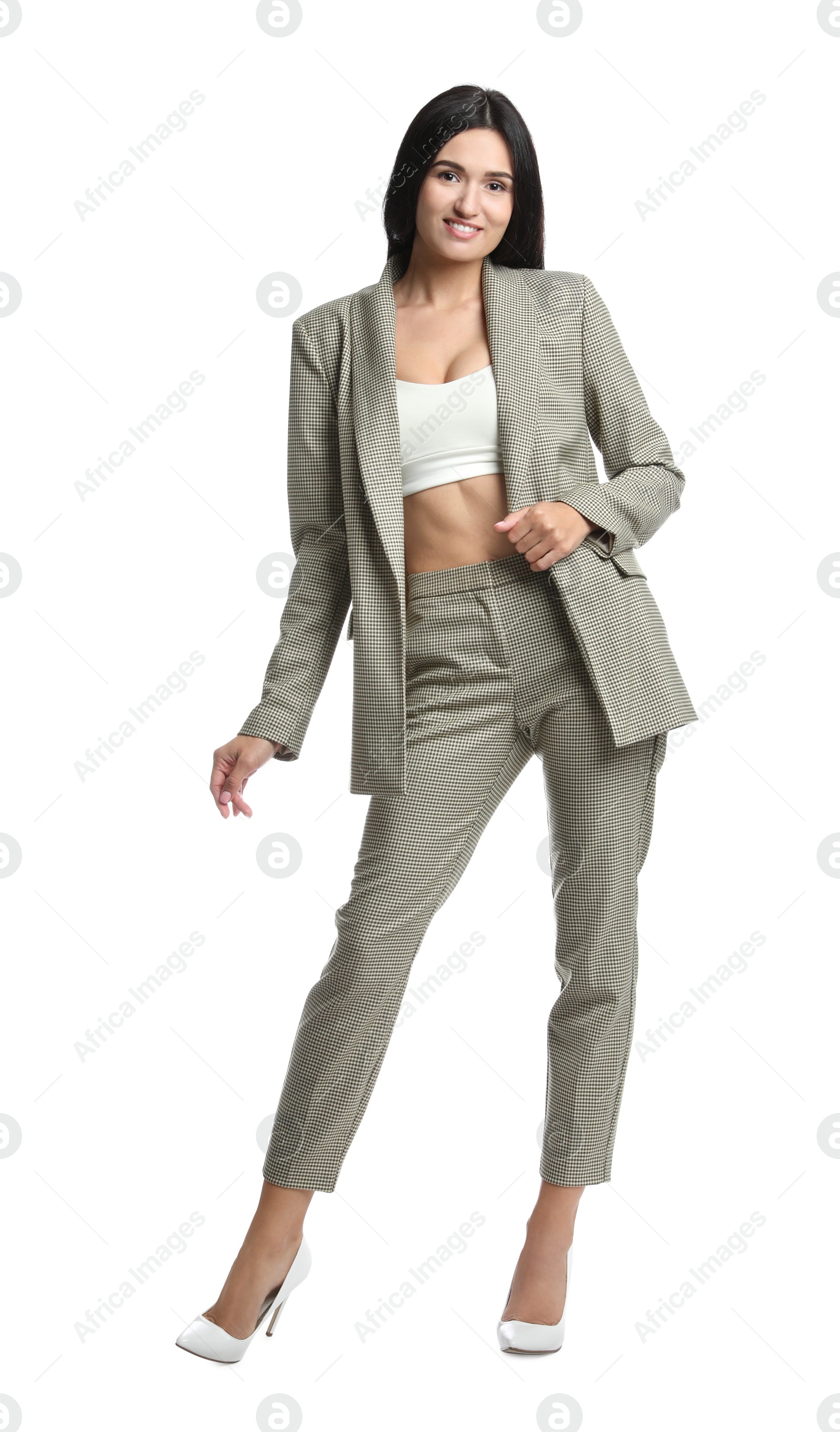 Photo of Full length portrait of beautiful woman in formal suit on white background