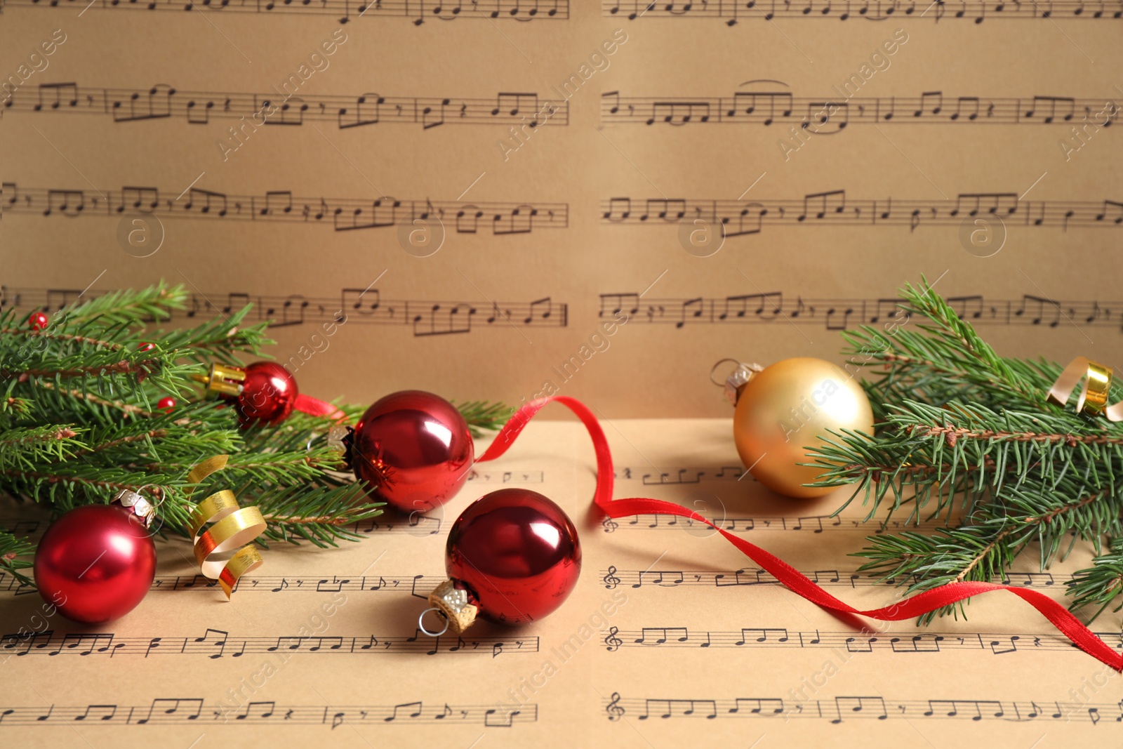 Photo of Composition with Christmas decorations on music sheets