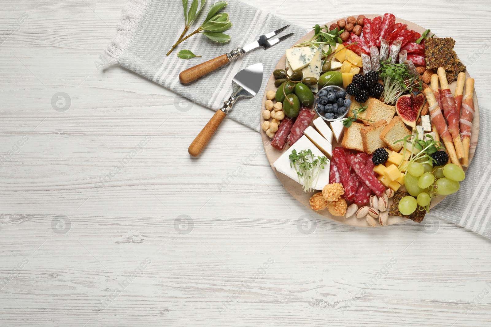 Photo of Different tasty appetizers on white wooden table, flat lay. Space for text