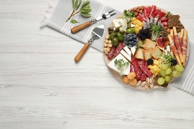 Photo of Different tasty appetizers on white wooden table, flat lay. Space for text