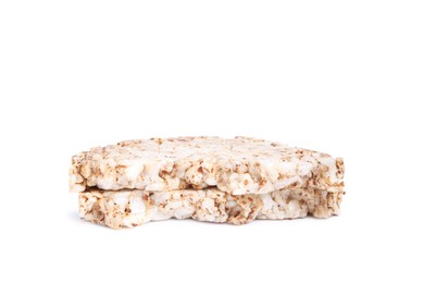 Photo of Tasty crunchy buckwheat cakes on white background