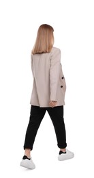 Photo of Businesswoman walking on white background, back view