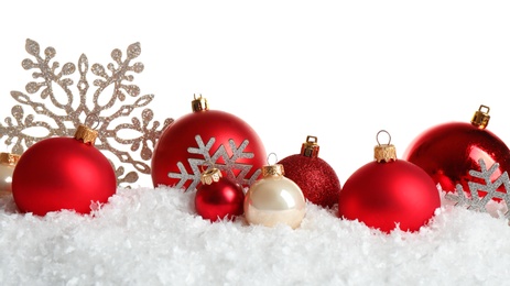 Christmas tree decoration on artificial snow against white background