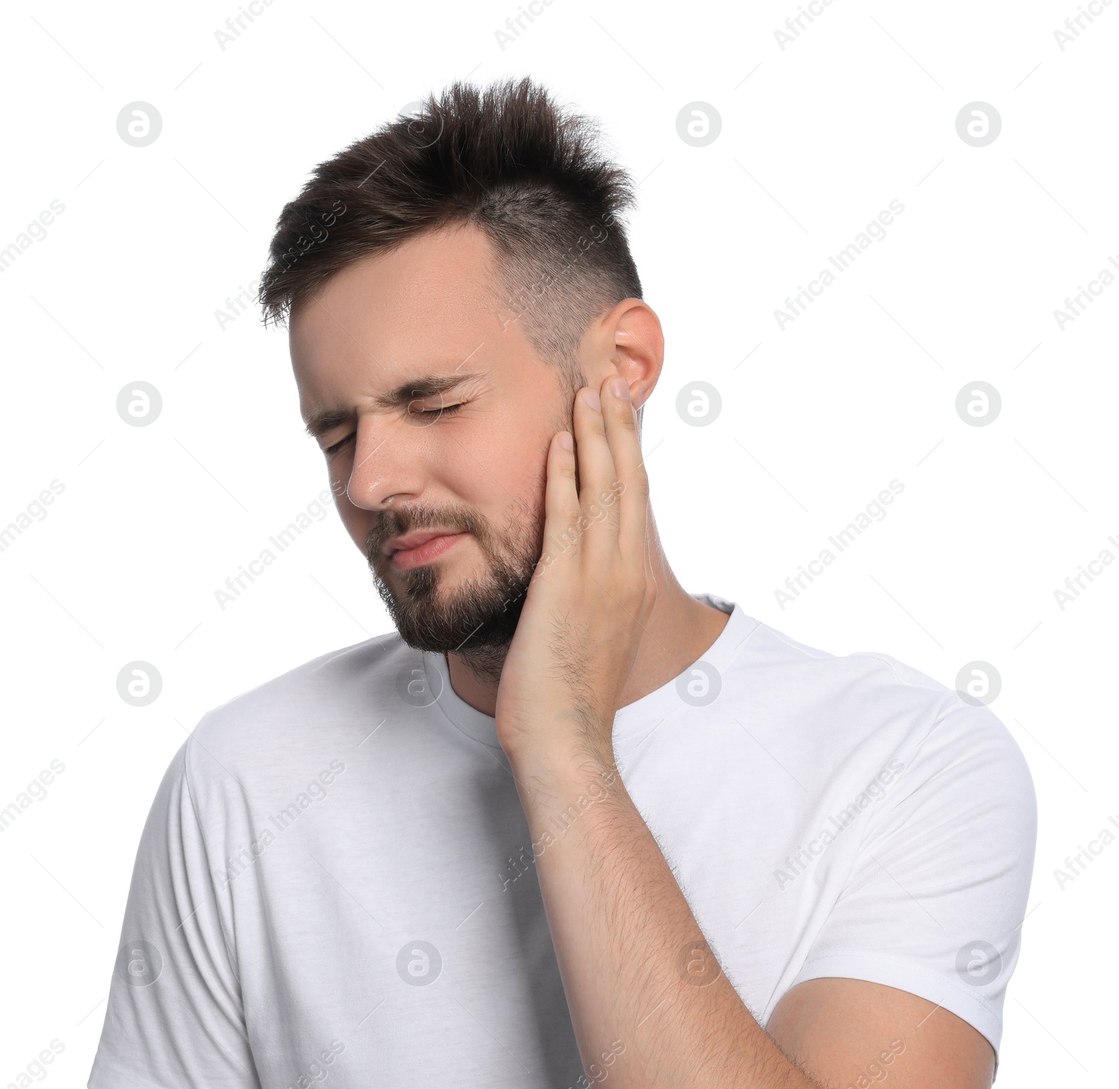 Photo of Young man suffering from ear pain on white background