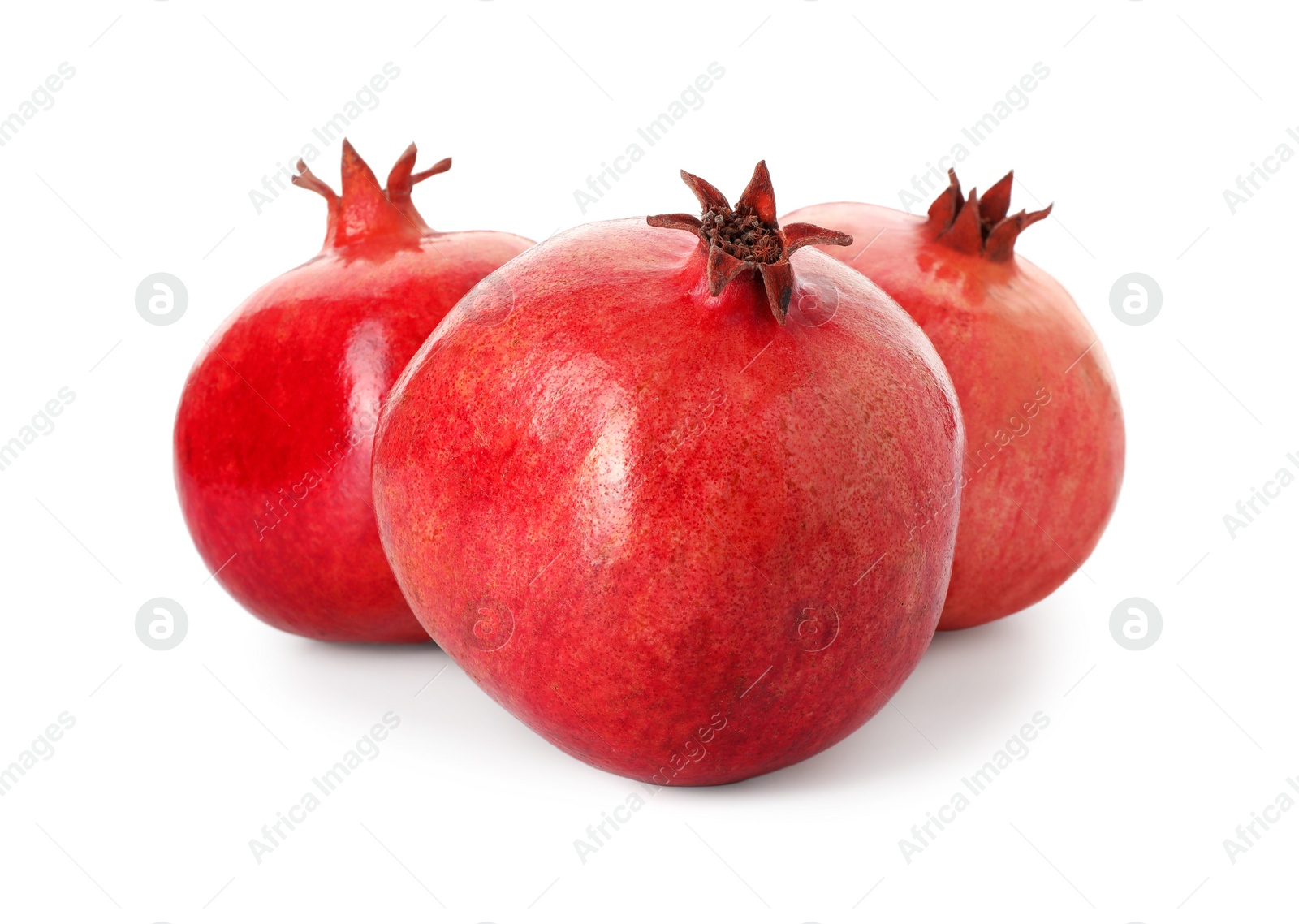 Photo of Many fresh ripe pomegranates isolated on white