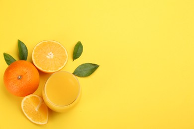 Photo of Delicious orange juice and fresh fruits on yellow background, flat lay. Space for text