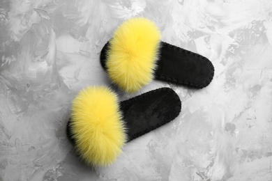Photo of Pair of soft slippers on grey background, flat lay