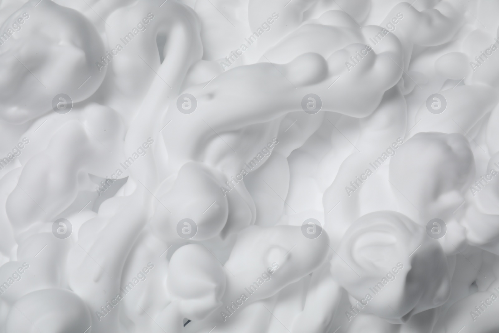 Photo of Texture of white shaving foam as background, top view