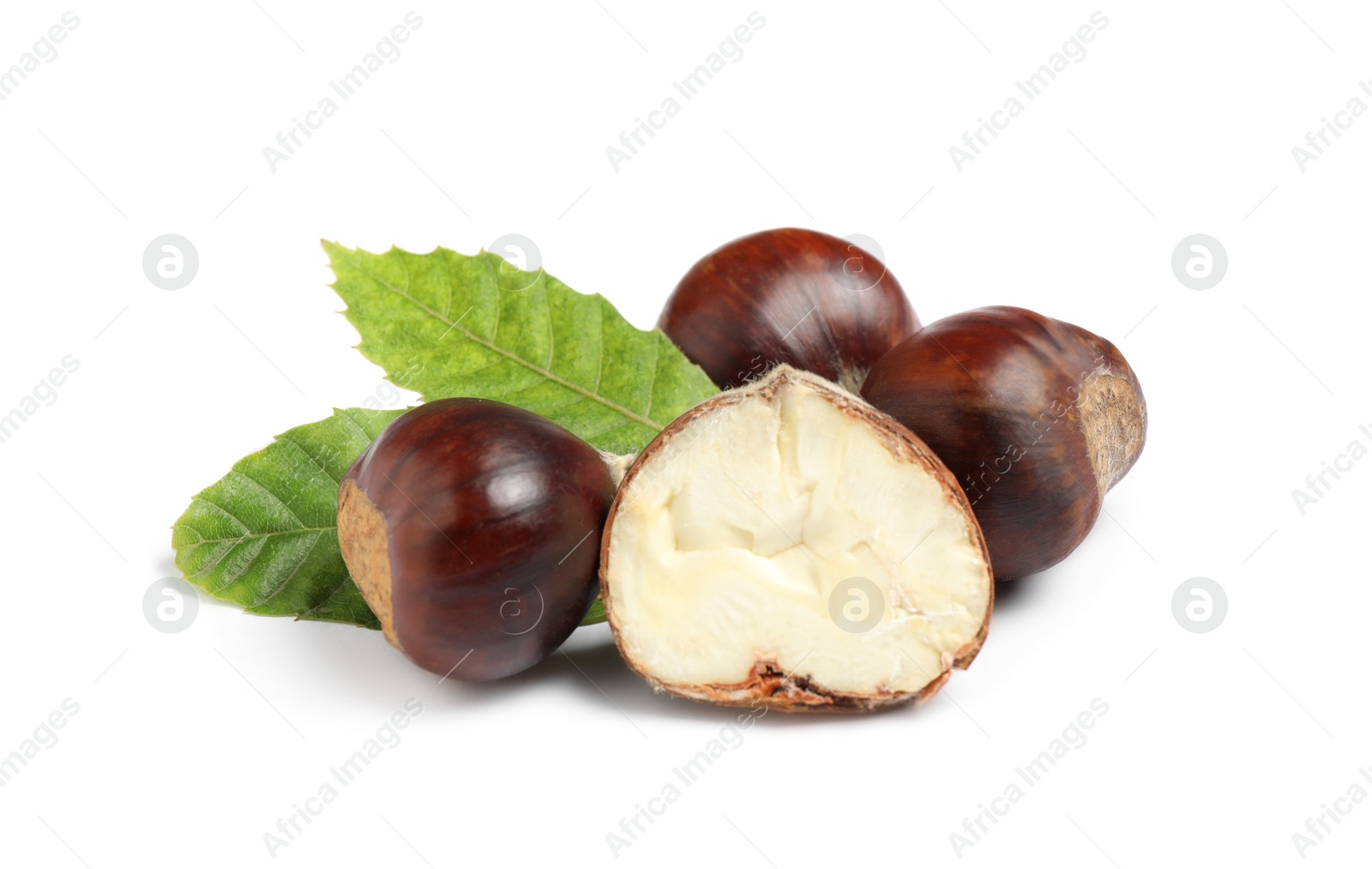 Photo of Fresh sweet edible chestnuts with green leaves on white background