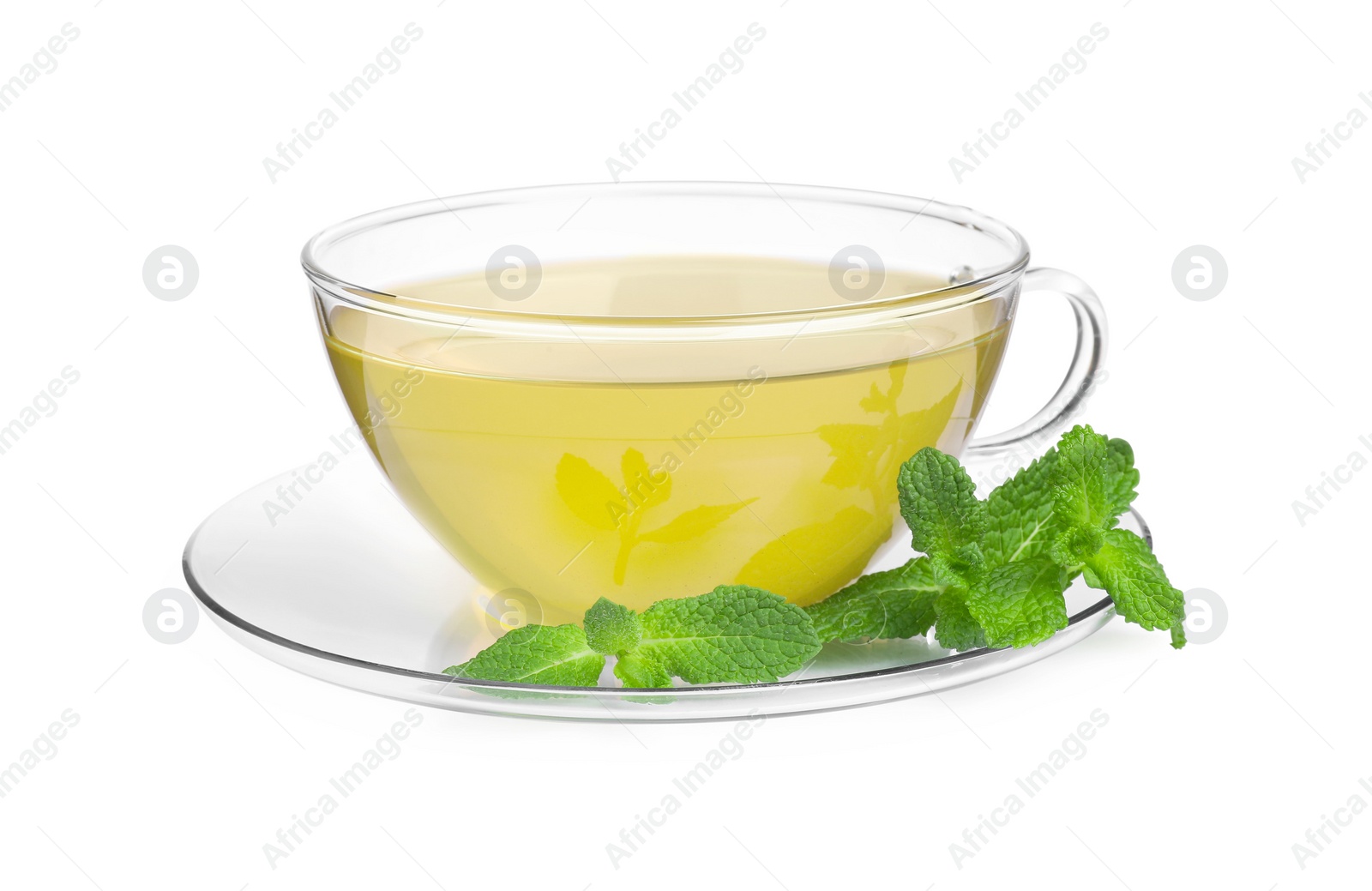 Photo of Fresh green tea in glass cup, mint and saucer isolated on white