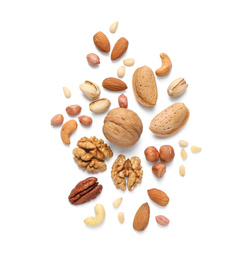 Photo of Different delicious nuts on white background, flat lay