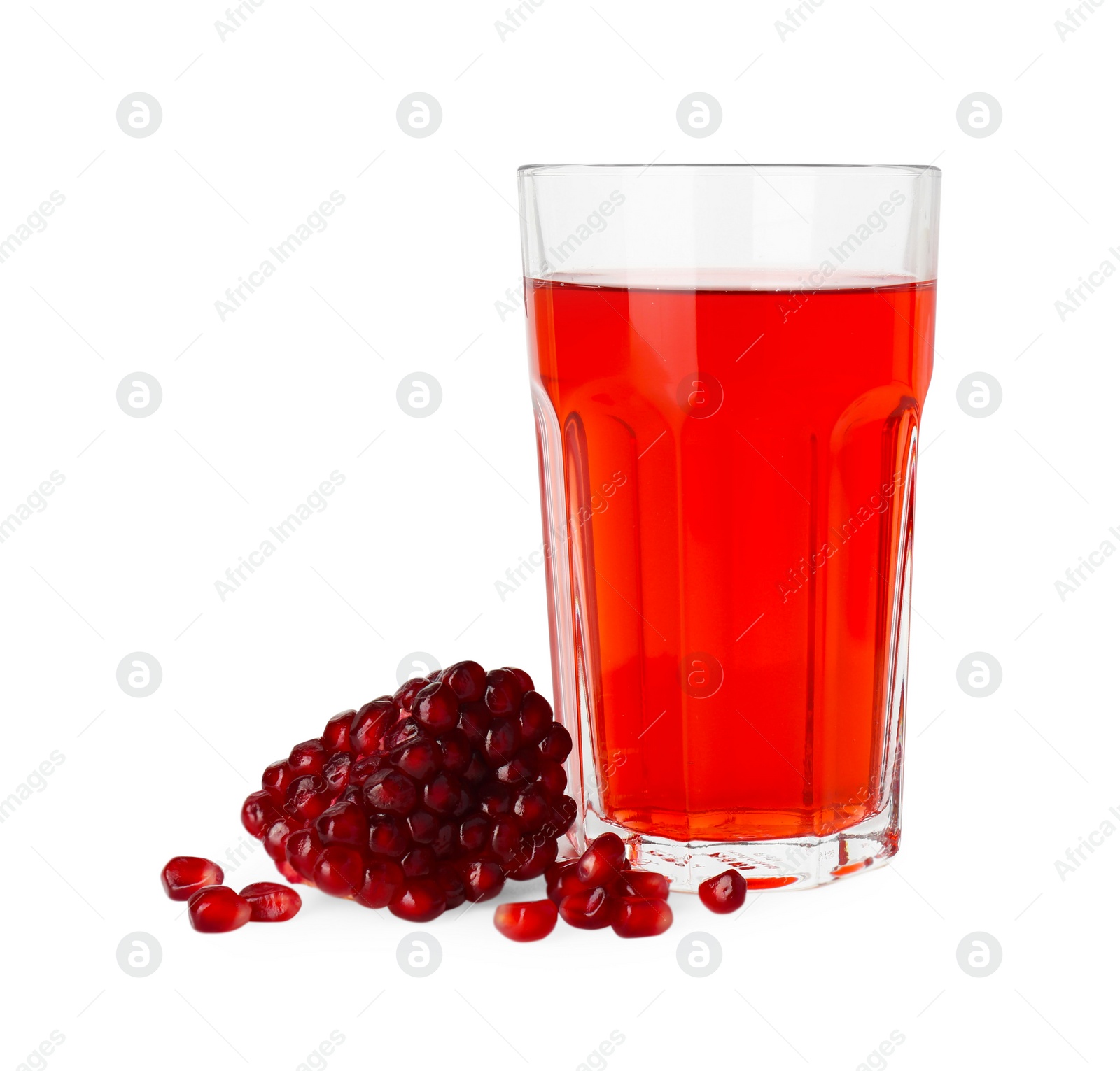 Photo of Refreshing pomegranate juice in glass and seeds isolated on white