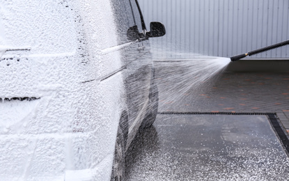 Photo of Covering automobile with foam at car wash