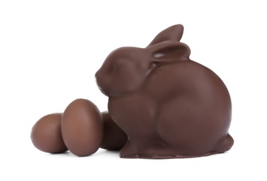 Photo of Chocolate Easter bunny and eggs on white background