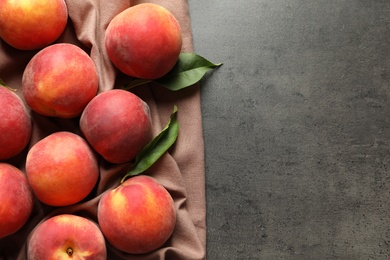 Photo of Fresh sweet peaches on table, top view