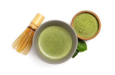 Photo of Cup of fresh matcha tea, bamboo whisk and green powder isolated on white, top view