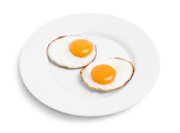 Photo of Plate with delicious fried eggs isolated on white