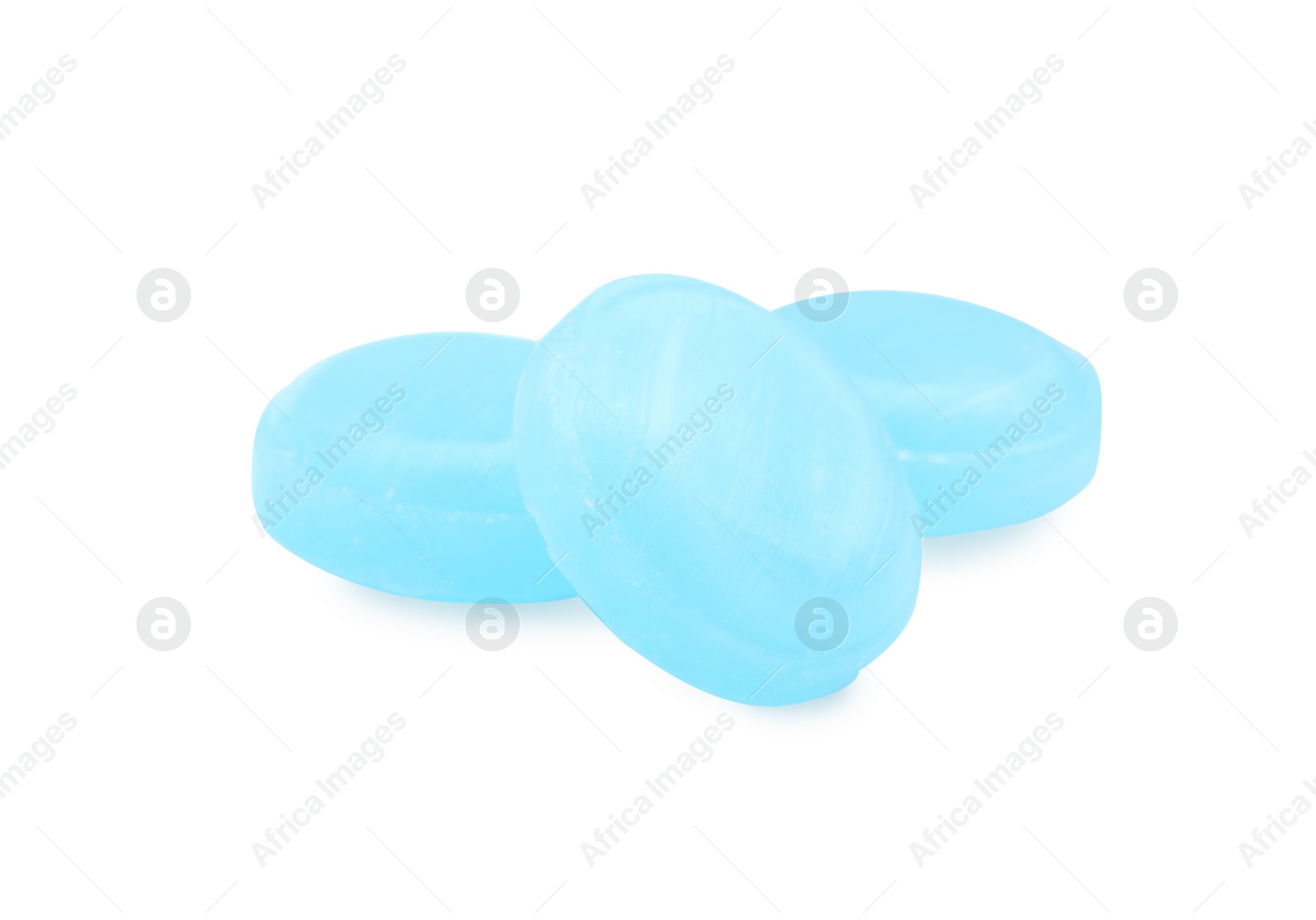 Photo of Light blue cough drops on white background