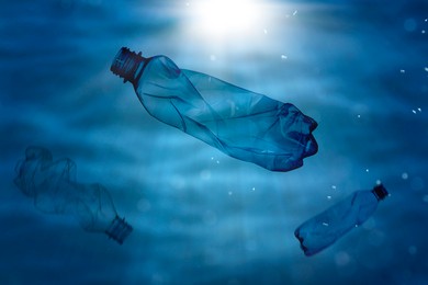 Many plastic bottles in ocean. Environmental pollution