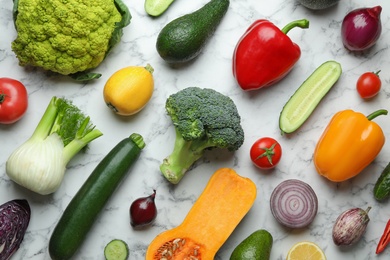 Flat lay composition with fresh ripe vegetables and fruits on marble background