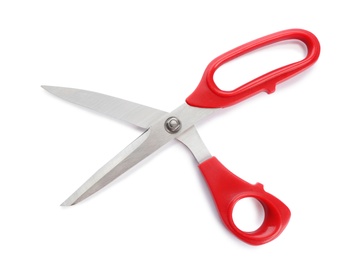 Pair of sharp sewing scissors on white background