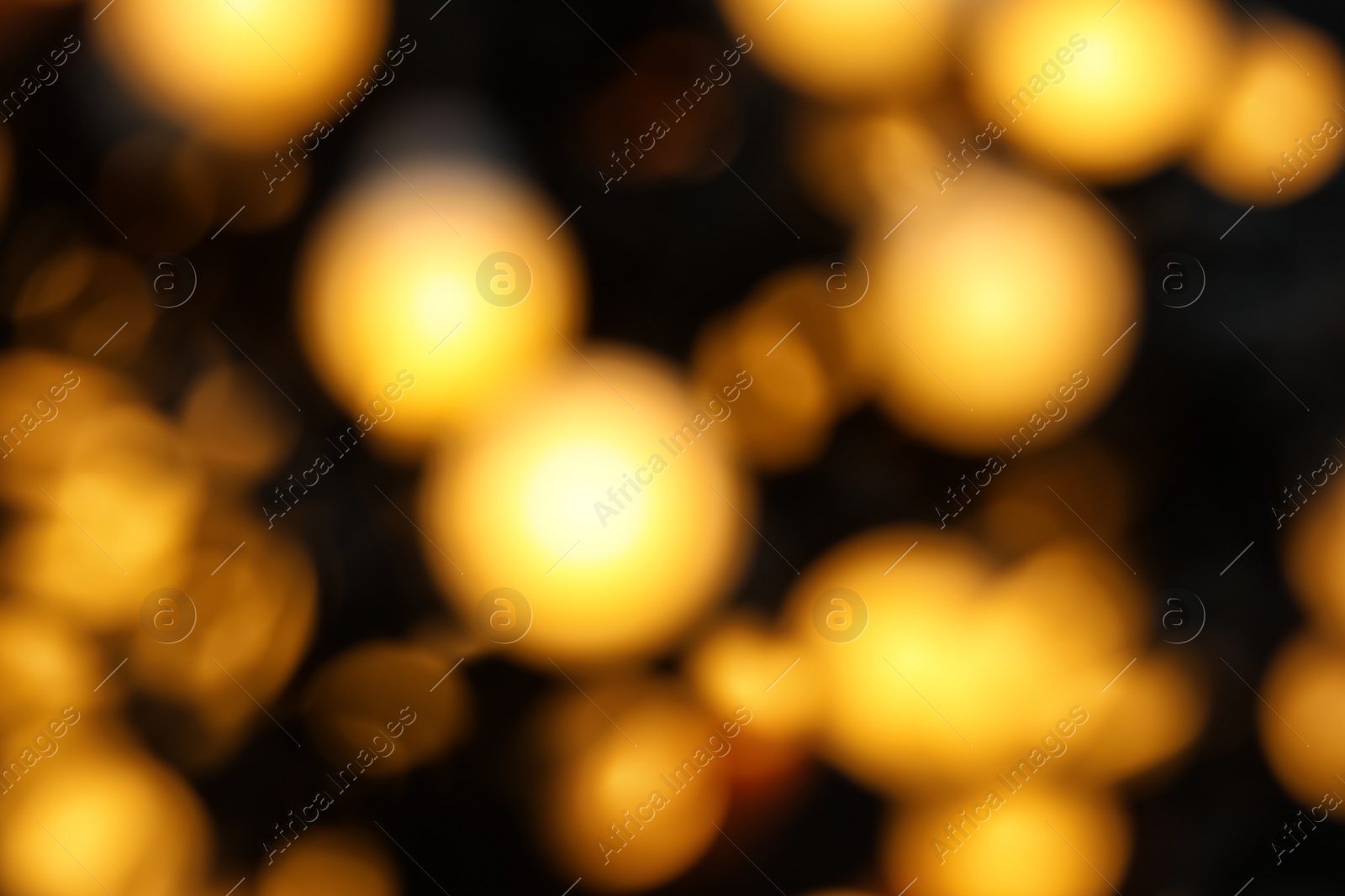 Photo of Blurred view of beautiful Christmas lights. Festive background