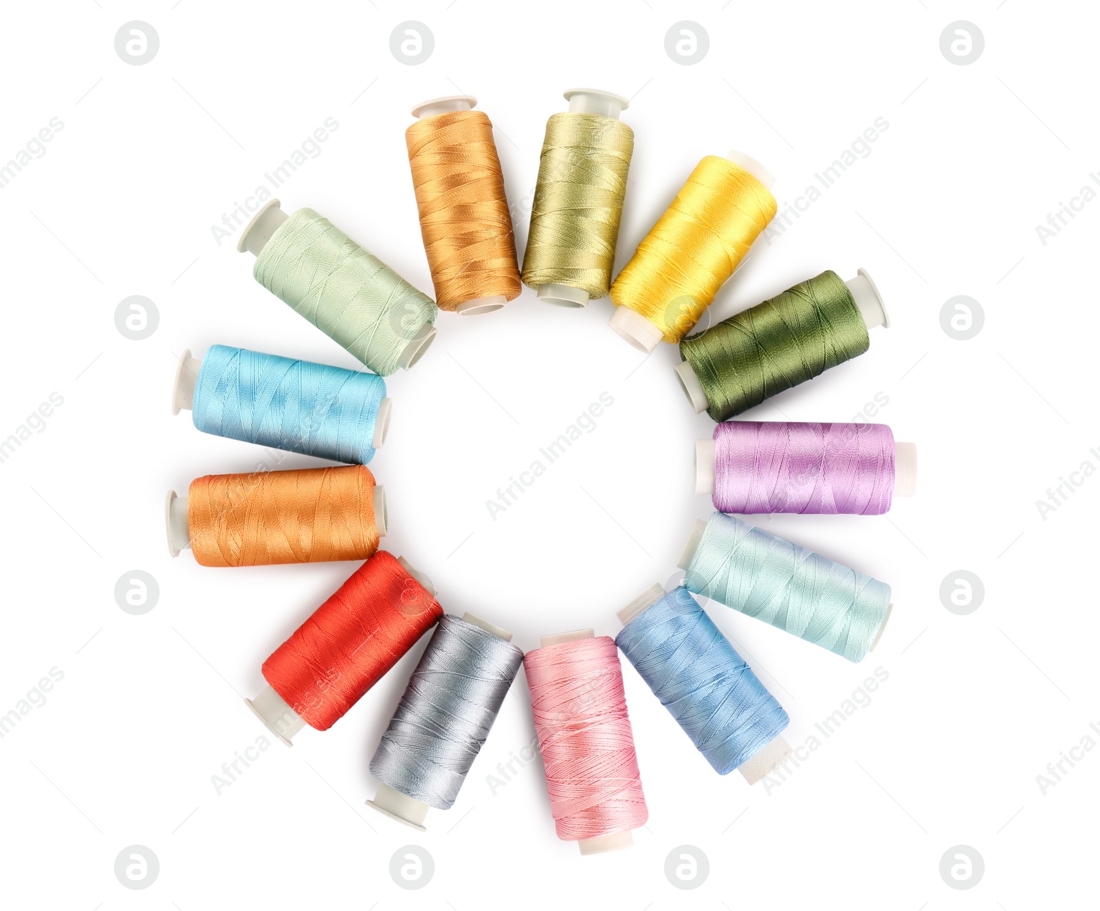 Photo of Frame of colorful sewing threads on white background, top view. Space for text