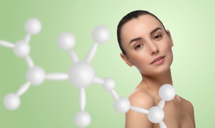 Beautiful woman with perfect healthy skin and molecular model on light green background, banner design. Innovative cosmetology