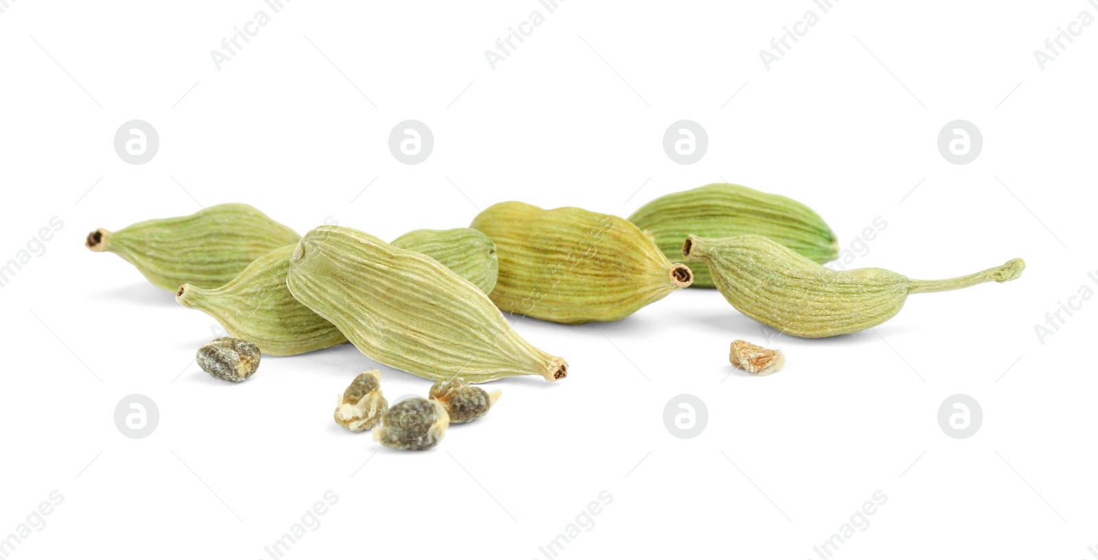 Photo of Pile of dry green cardamom pods isolated on white