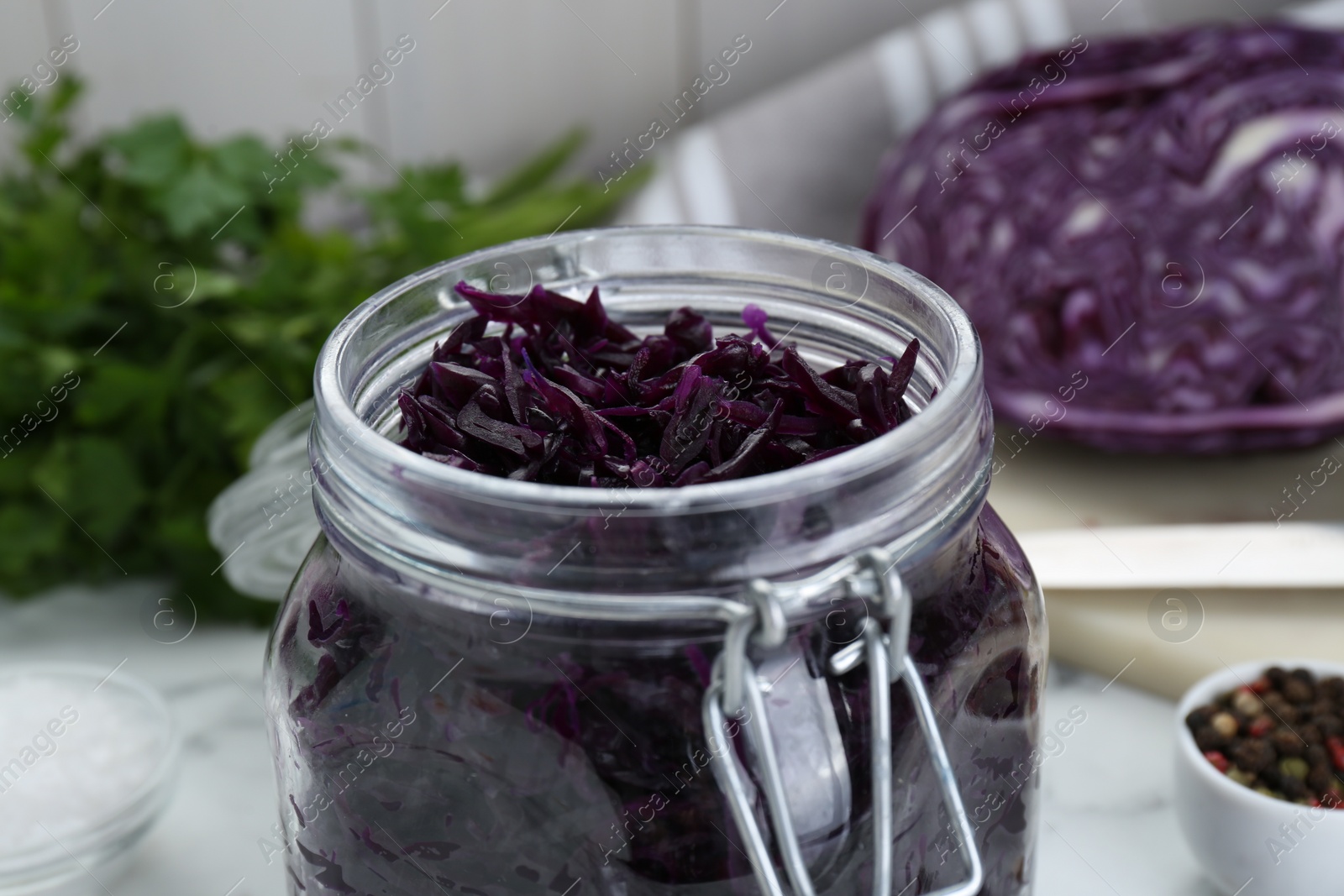 Photo of Tasty red cabbage sauerkraut on table, closeup