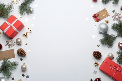 Composition with Christmas decorations on white background, top view. Winter season