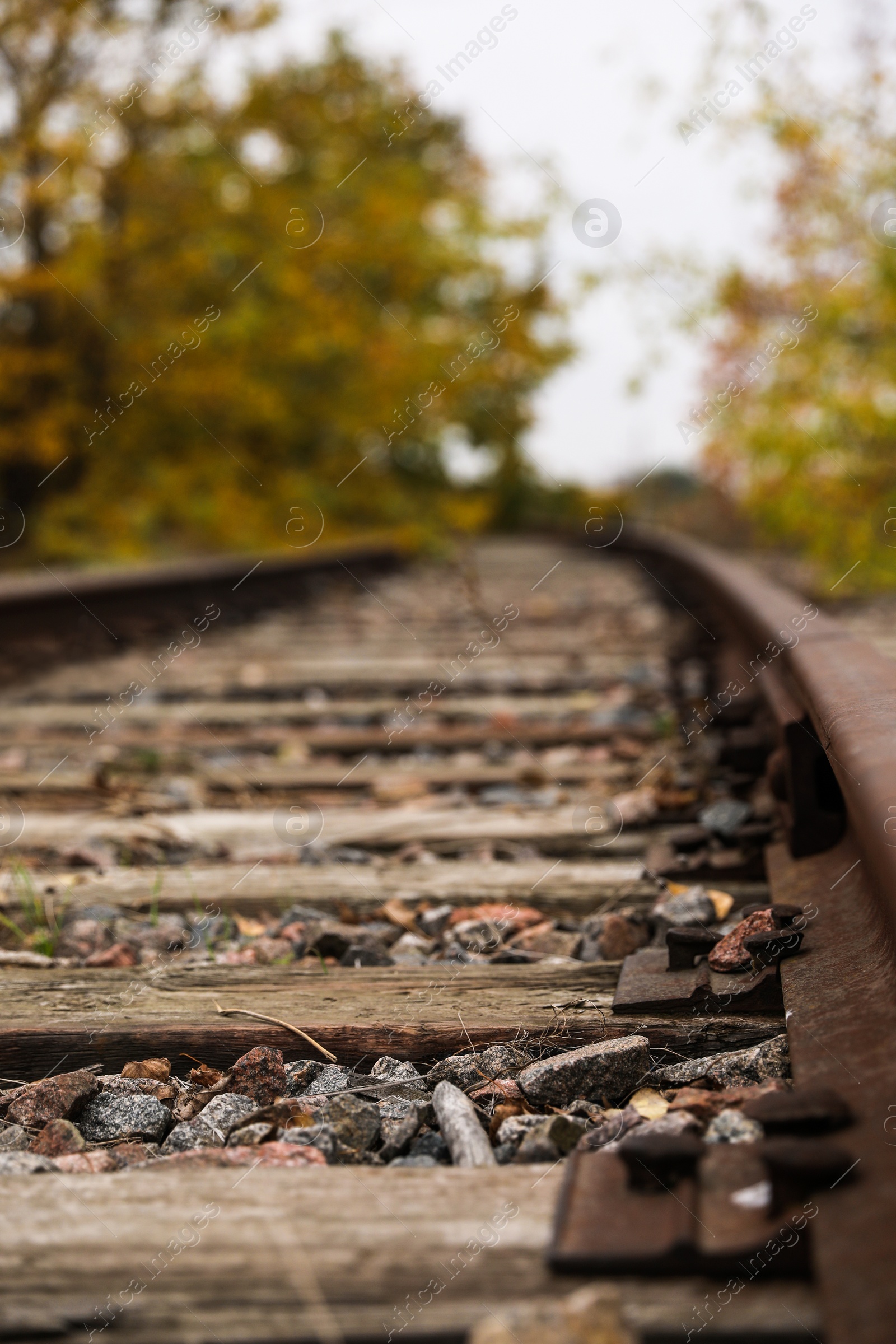 Photo of Railway line with track ballast in countryside, closeup. Train journey