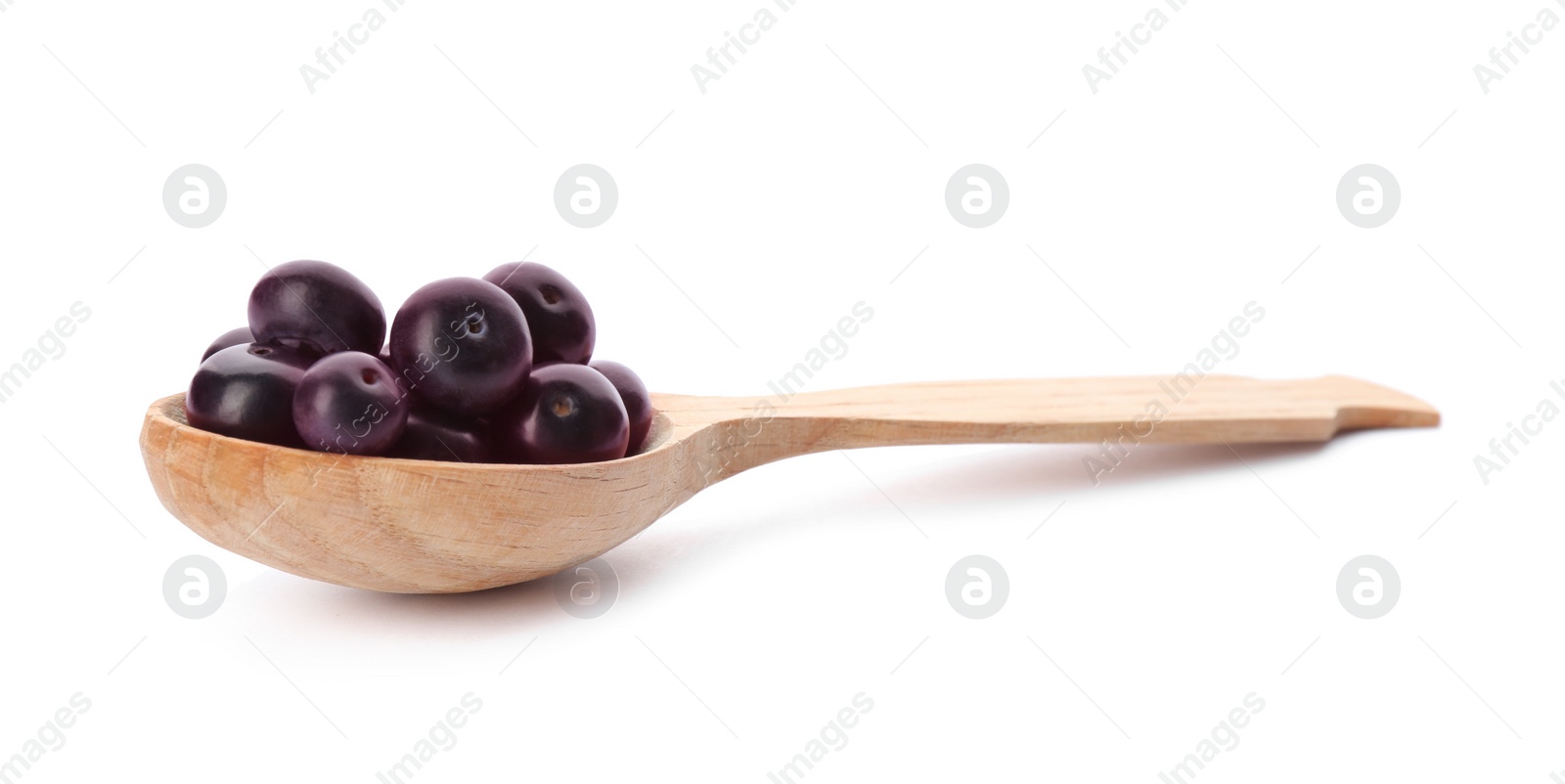 Photo of Fresh acai berries in wooden spoon isolated on white