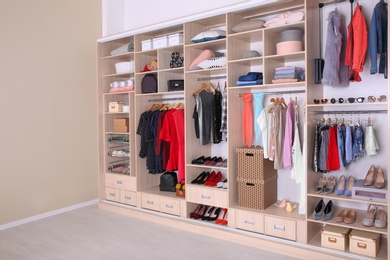 Large wardrobe with different clothes, home stuff and shoes