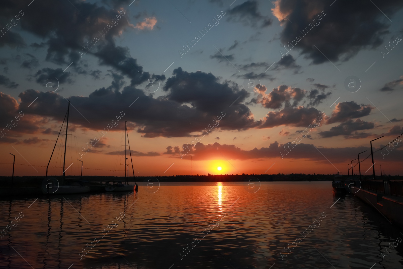 Photo of Picturesque view of beautiful sunset on riverside