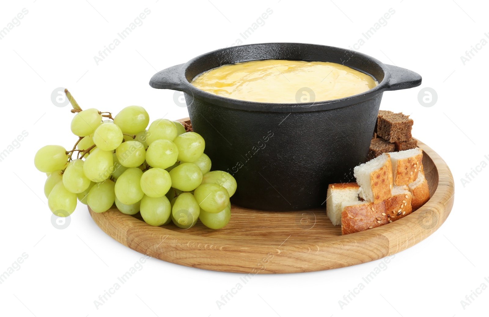 Photo of Fondue with tasty melted cheese and grapes isolated on white
