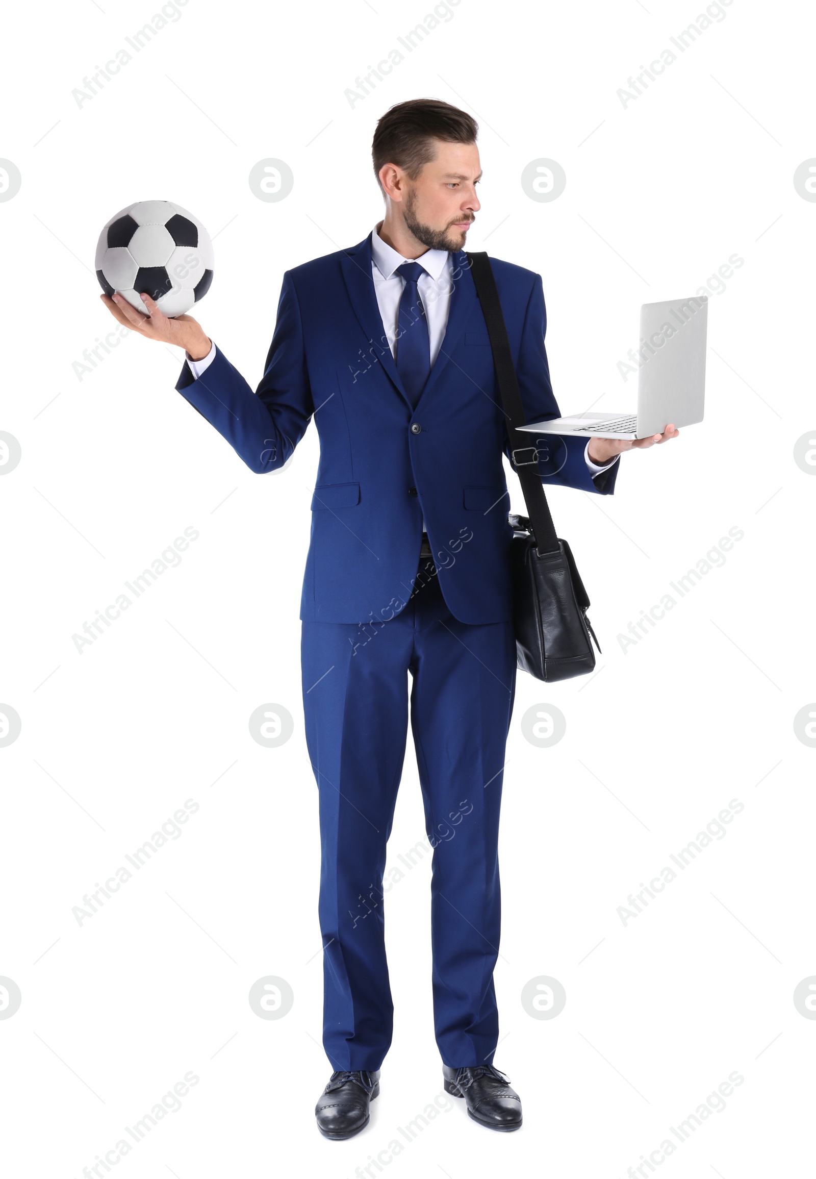 Photo of Full length portrait of businessman with briefcase, soccer ball and laptop on white background. Combining life and work