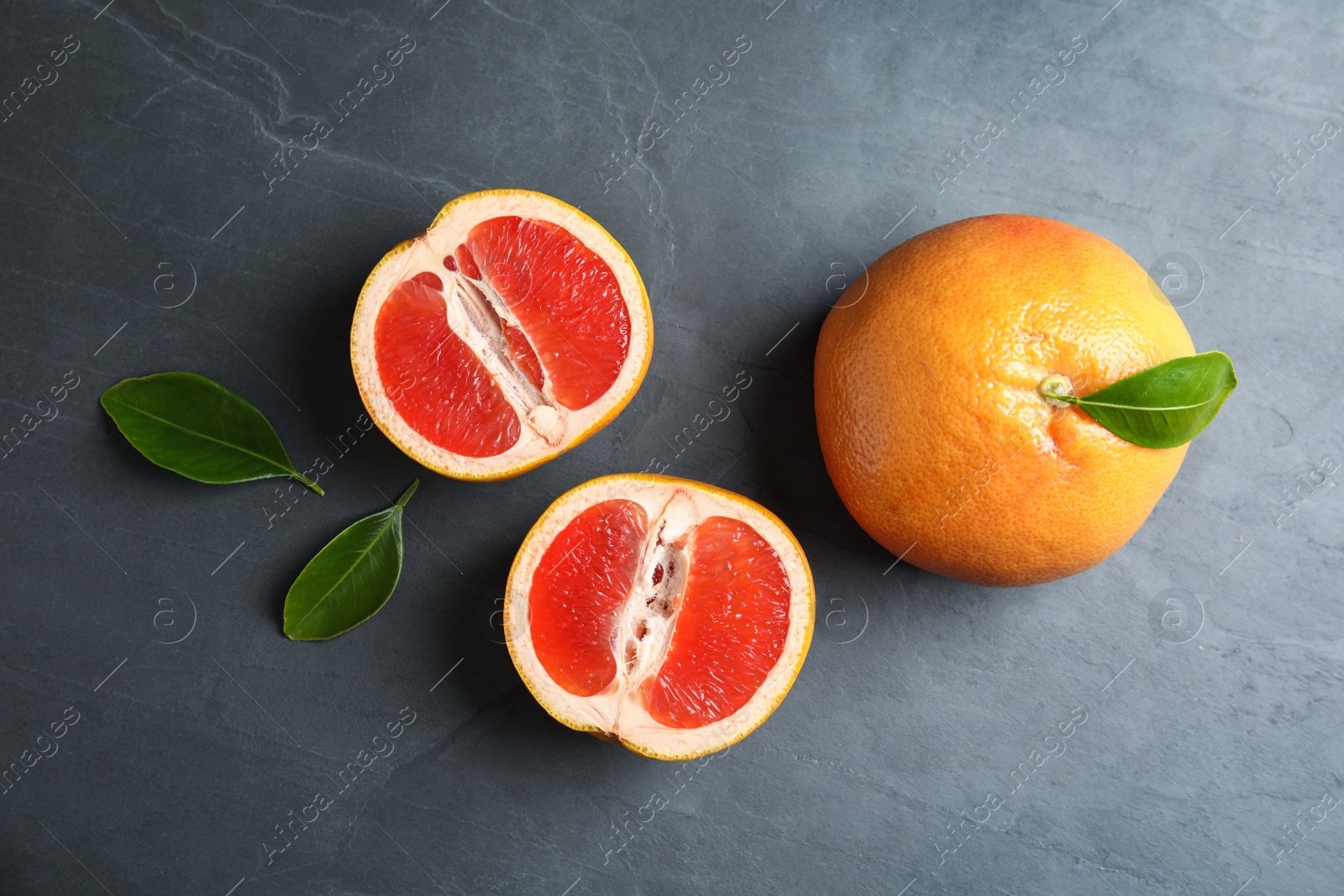 Photo of Fresh tasty grapefruits on table, top view