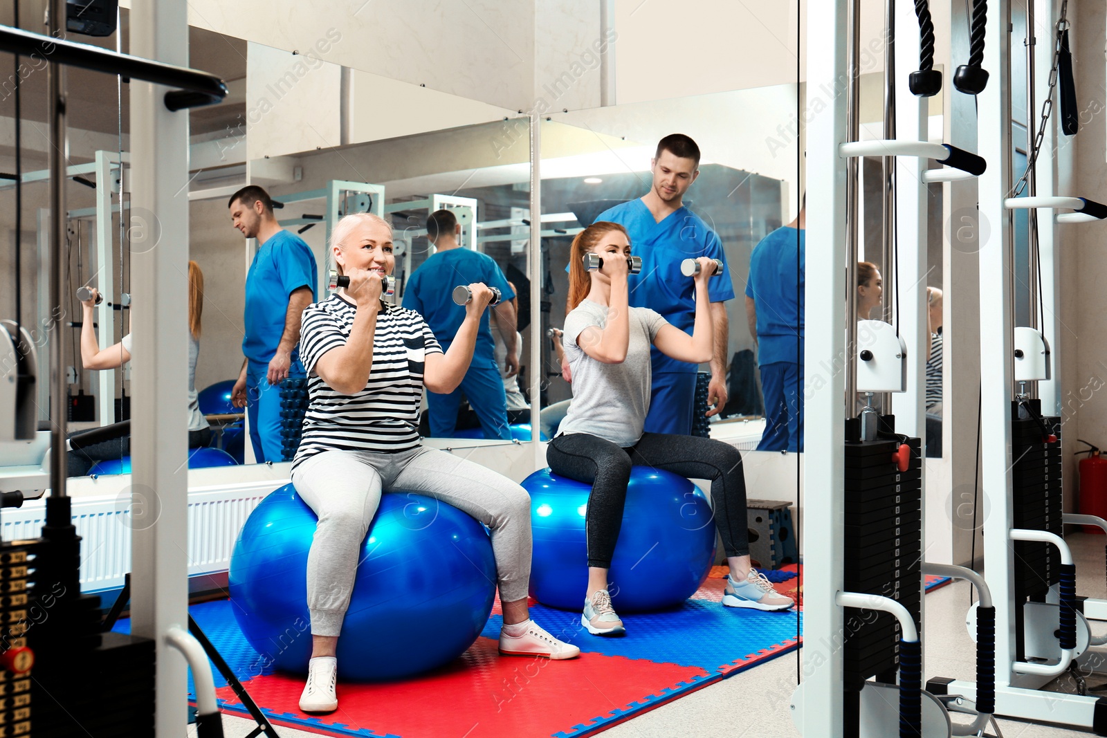 Photo of Patients exercising under physiotherapist supervision in rehabilitation center