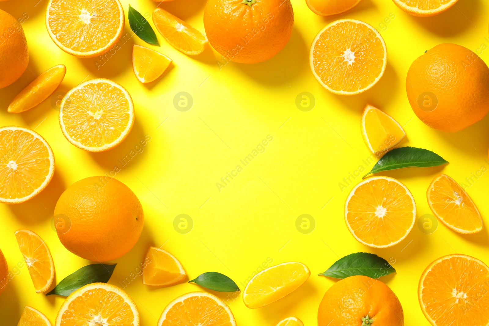 Photo of Flat lay composition with ripe oranges and space for text on color background