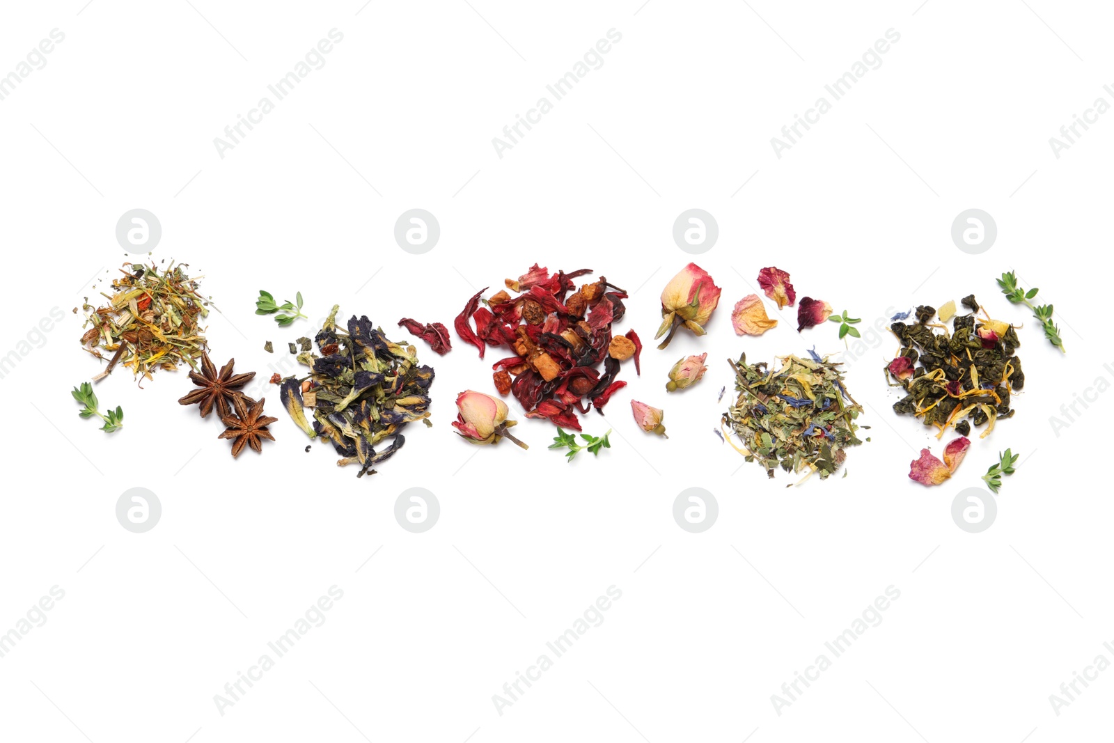 Photo of Different dry herbal teas on white background, top view