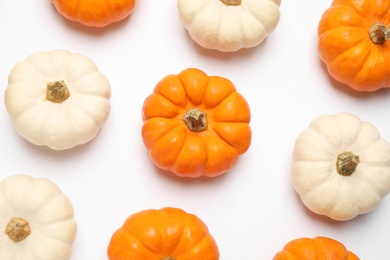 Photo of Different ripe pumpkins on white background, top view