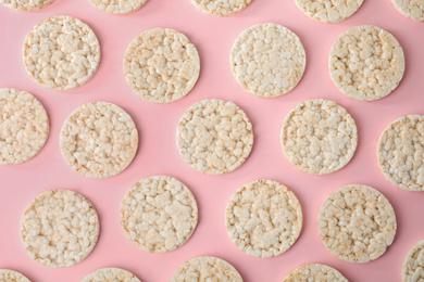 Photo of Puffed rice cakes on pink background, flat lay