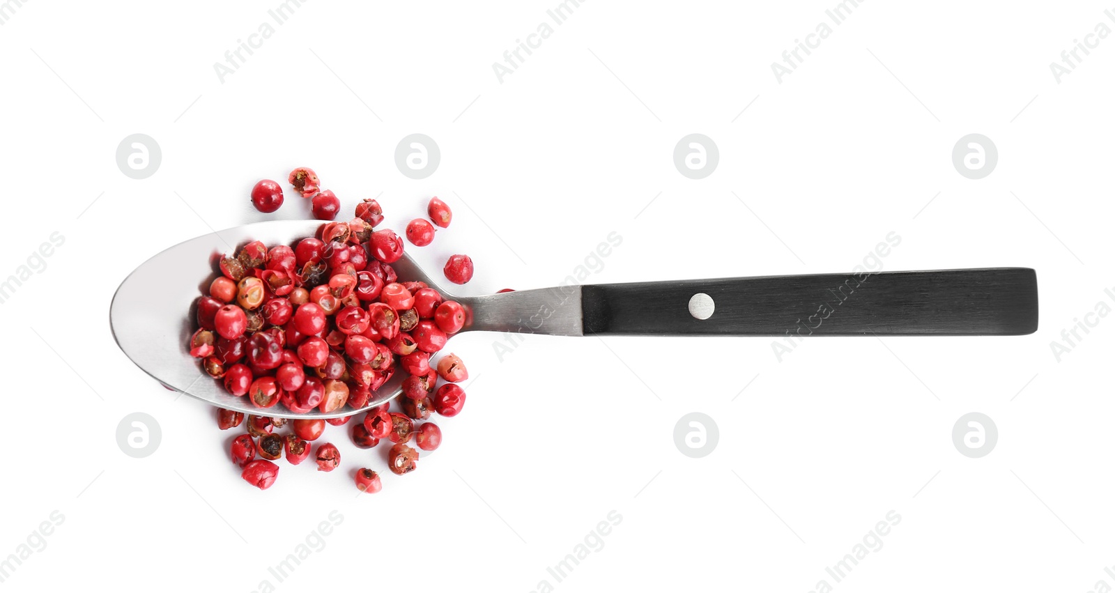 Photo of Spoon of red peppercorns isolated on white, top view