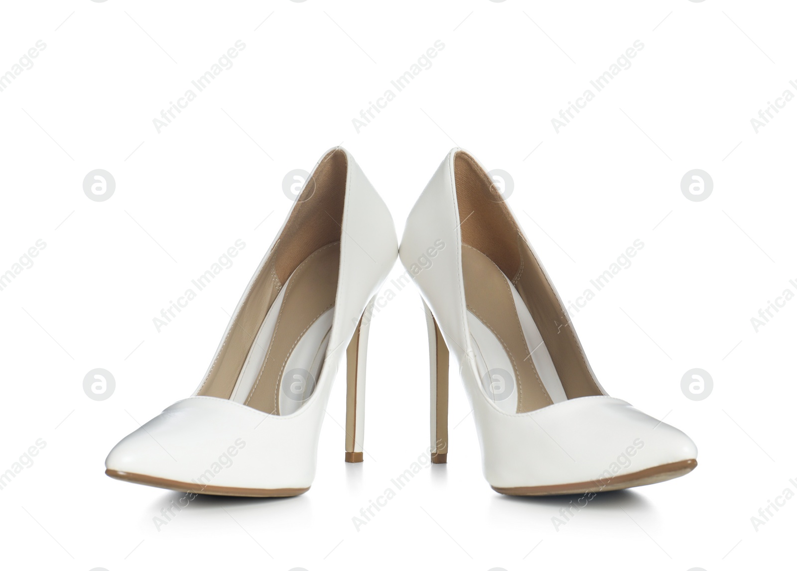 Photo of Beautiful classic wedding shoes on white background