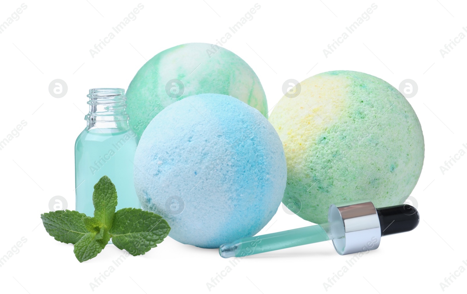 Photo of Fragrant bath bombs, oil and mint on white background