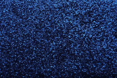 Beautiful shiny blue glitter as background, closeup