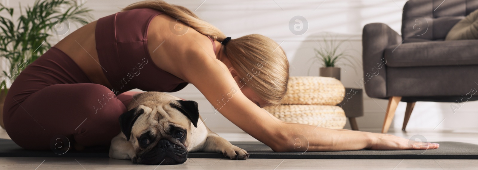 Image of Woman with dog practicing yoga at home. Horizontal banner design 