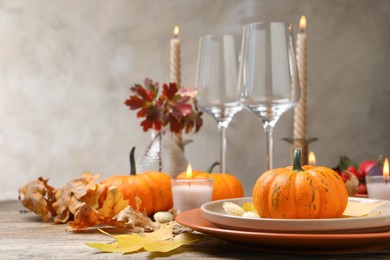 Photo of Beautiful autumn place setting and decor on wooden table, space for text