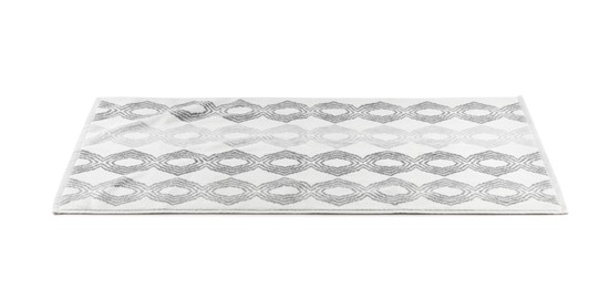 Photo of New bath mat with beautiful pattern isolated on white